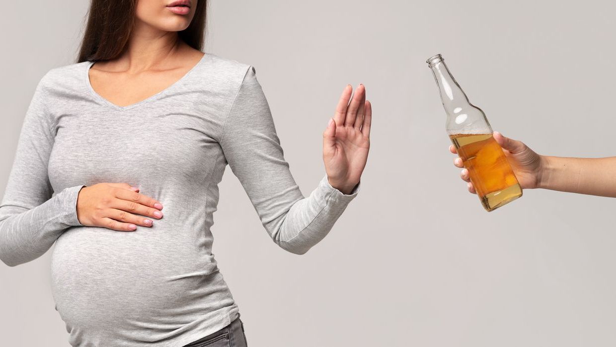 — title missing — Pregnant woman refusing beer
