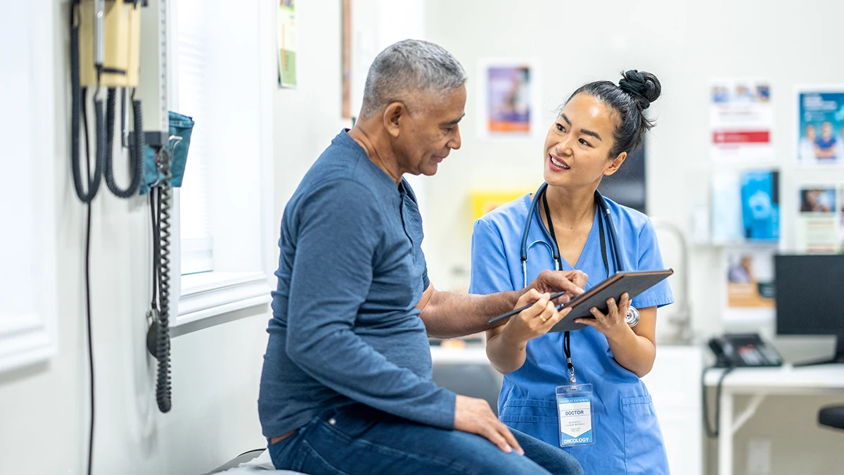 HMP-toolkit-cover Medical professional shaking hands with a man.